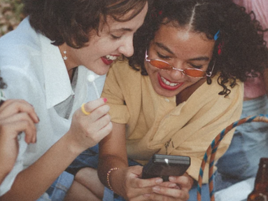 girls looking at their phones