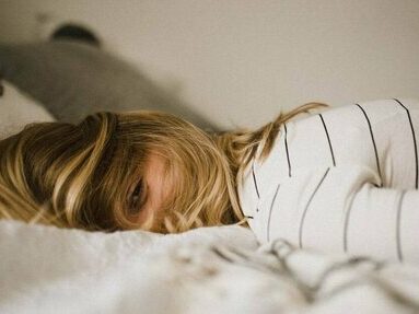 a girl laying in her bed
